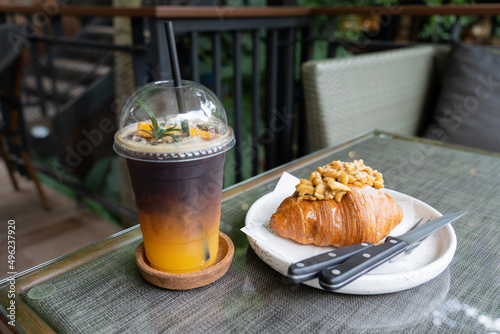 Coffee Orange juice on  table seaside during sunset sky. 