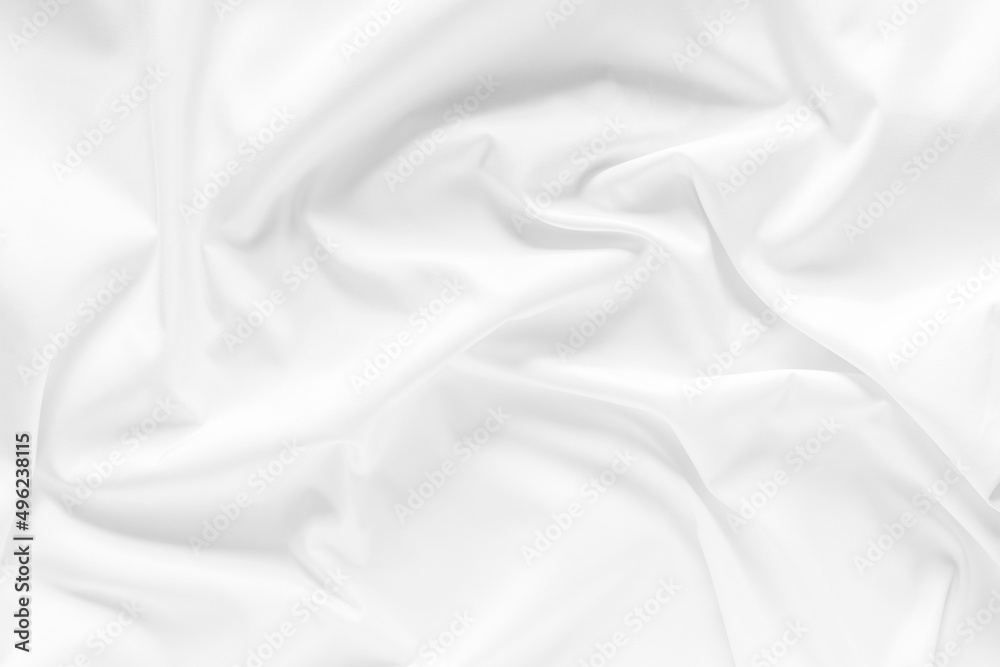 Obraz premium White fabric texture background. Cloth soft wave. Creases of satin, silk, and cotton.