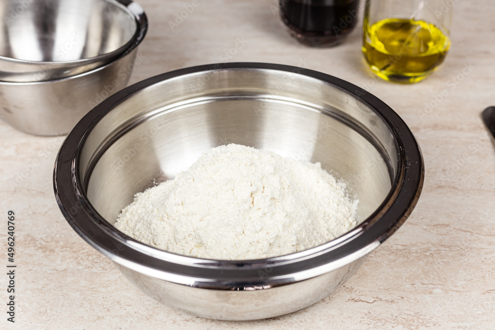 Flour in a steel bowl to create a recipe. Cook at home