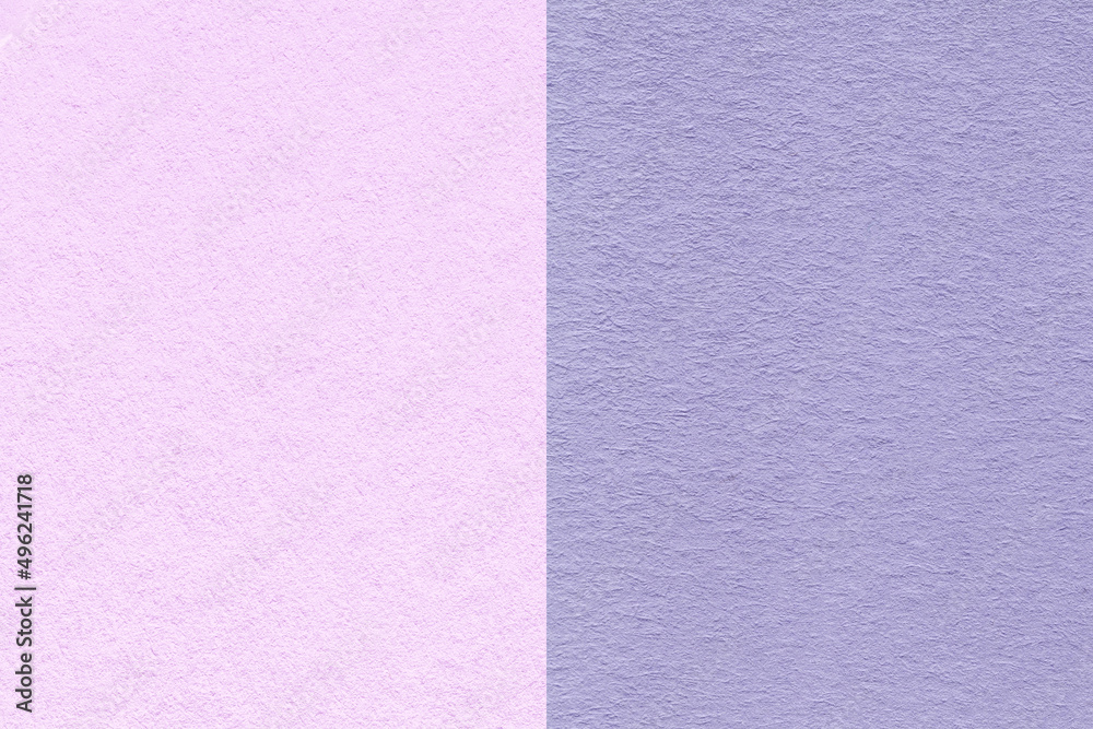 Fototapeta premium Texture of craft pastel lilac and violet paper background, half two colors. Structure of vintage purple cardboard.