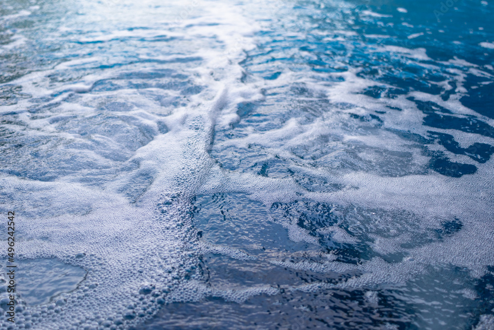 air bubbles ejected in water with a pressure generator inside the jacuzzi relax the body when immersed in the bath as it is a water pressure massage system. Bathtub Background with Copy Space