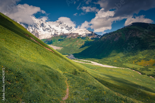 Green hiils of Caucasus mountains. Womderful summer view of Upper Svaneti. Majestic outdoor scene of the main Caucasian ridge, Georgia, Europe. Beauty of nature concept background..
