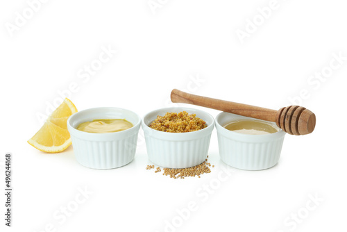 Bowls with sauces isolated on white background