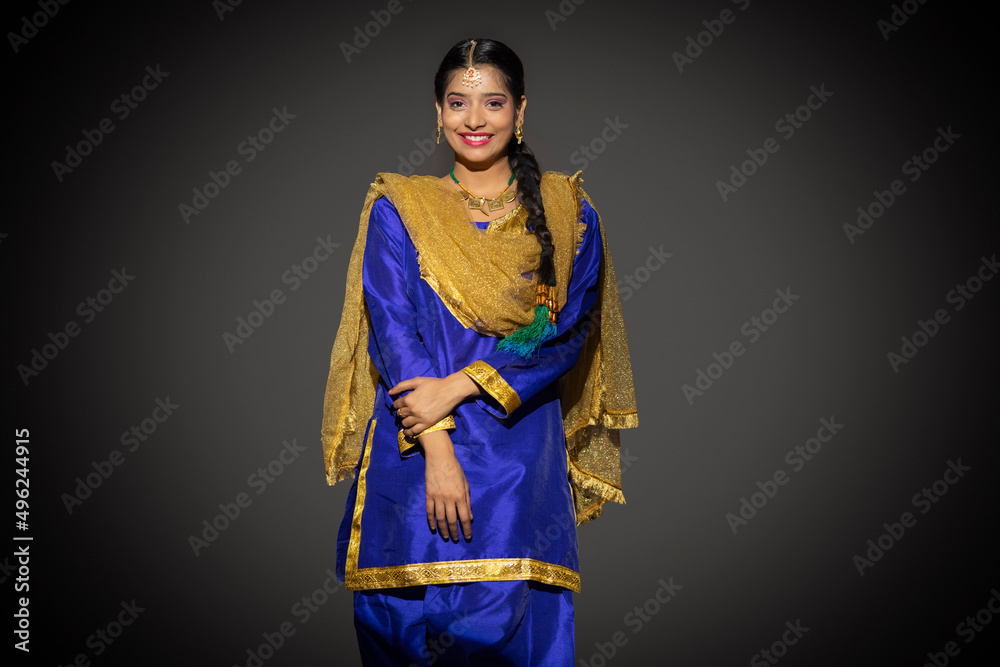 Portrait of a happy Sikh woman posing in front of camera Portrait of a happy Sikh woman posing in front of camera