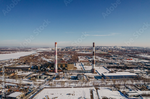 factories and pipes of a big city in winter