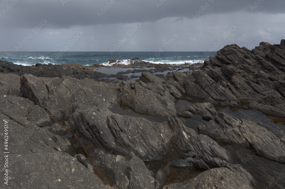 Gran Canaria, north coast, rockpools around Puertillo de Banaderos area protected from the 
ocean waves by volcanic rock barrier
