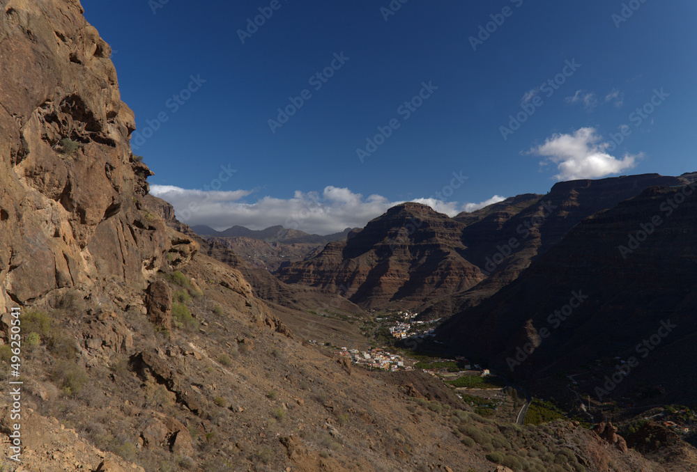 Gran Canaria, landscape of the southern part of the island along Barranco de Arguineguín steep and deep ravine
with vertical rock walls, circular hiking route visiting Elephant rock arch 