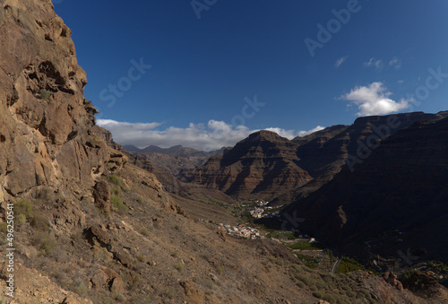 Gran Canaria, landscape of the southern part of the island along Barranco de Arguineguín steep and deep ravine with vertical rock walls, circular hiking route visiting Elephant rock arch 