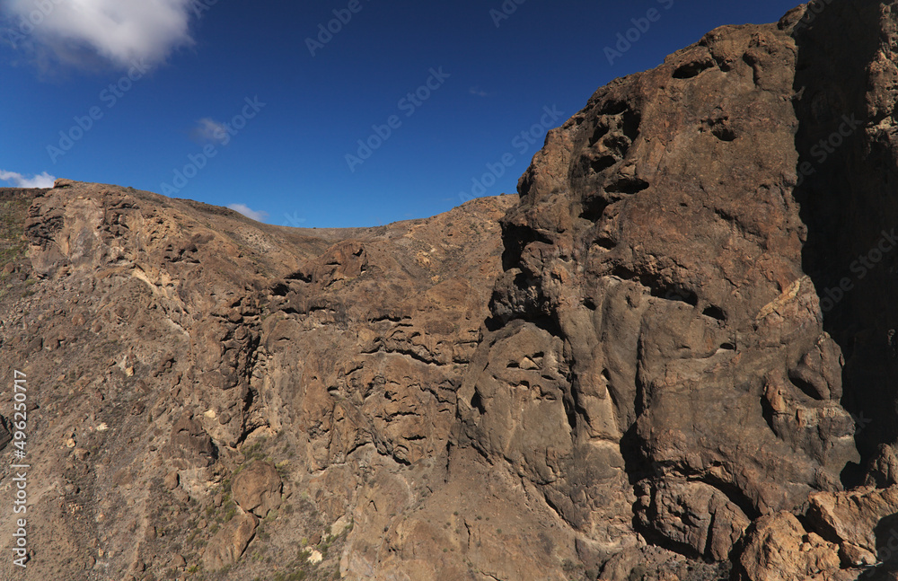 Gran Canaria, landscape of the southern part of the island along Barranco de Arguineguín steep and deep ravine
with vertical rock walls, circular hiking route visiting Elephant rock arch 