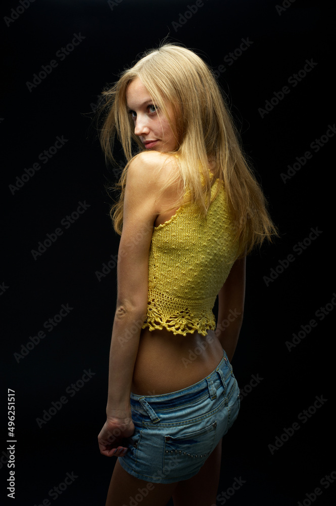 Young pretty woman with flower over black Young pretty woman with flower over black