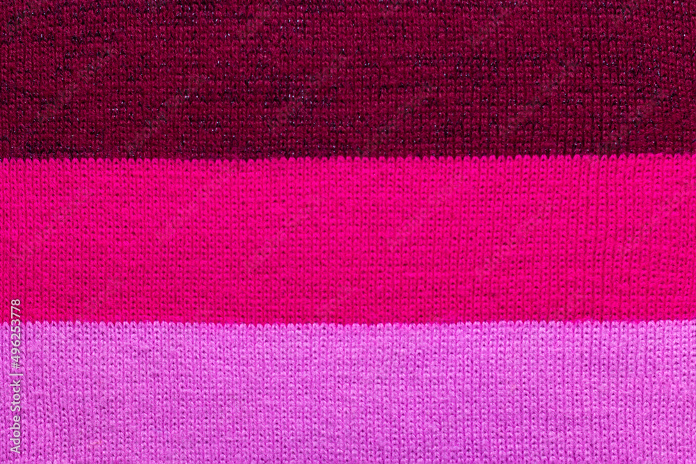 Obraz premium multi colored background. knitted wool fabric texture with stripes