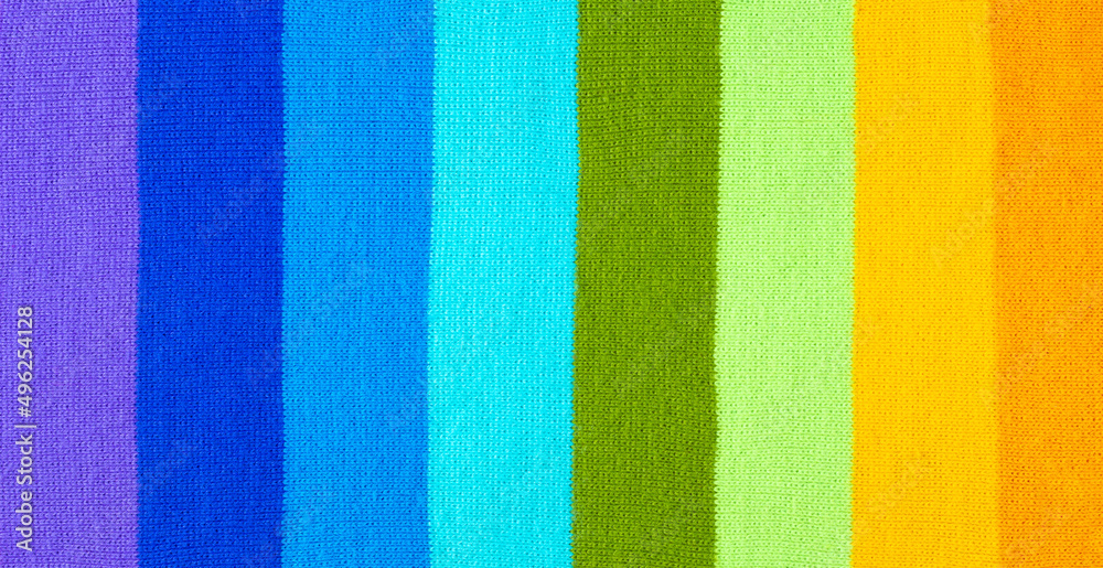 multi colored background. knitted wool fabric texture with stripes multi colored background. knitted wool fabric texture with stripes