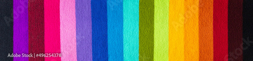 multi colored background. knitted wool fabric texture with rainbow stripes