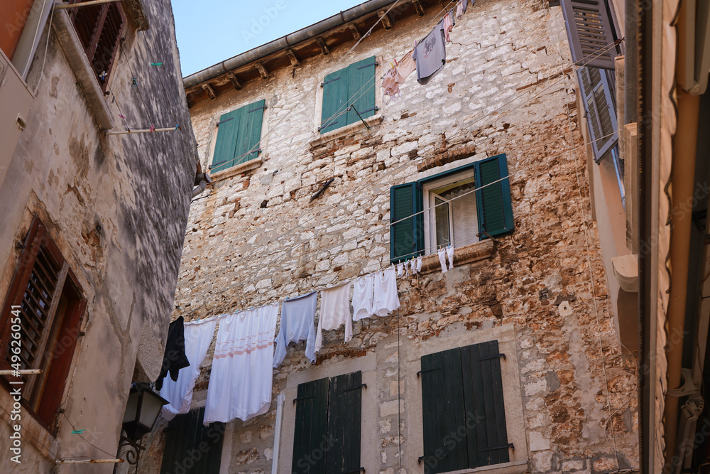 old istrian rock buildings in Rovinj with clothes drying 