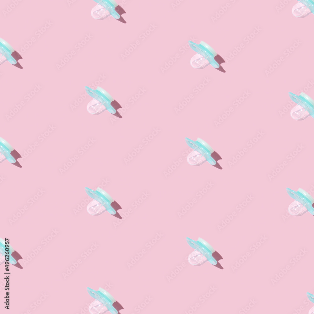 Naklejka premium Pattern pink baby pacifiers, dummy with rubber nipple on pink background.