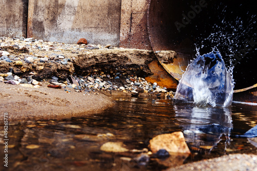 Wastewater discharge from an industrial enterprise and environmental pollution. Close-up