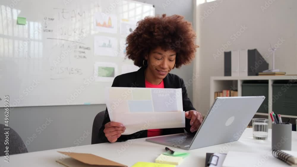 Creative businesswoman working in office using laptop Creative businesswoman working in office using laptop