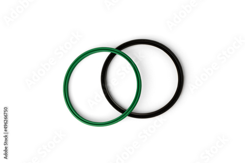 Green and black rubber gasket ring isolated on white background.