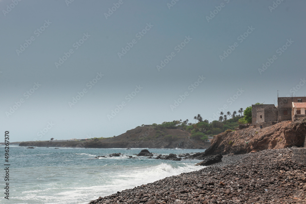Local beach with stones in one of the villages called Velha in Cabo Verde island of Santiago on a sunny autumn day.