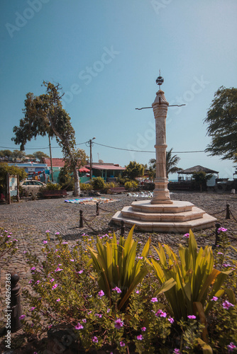 A monument in the main square of Velha, a suburb of Praia on Cabo Verde islands on a warm sunny autumn day. photo