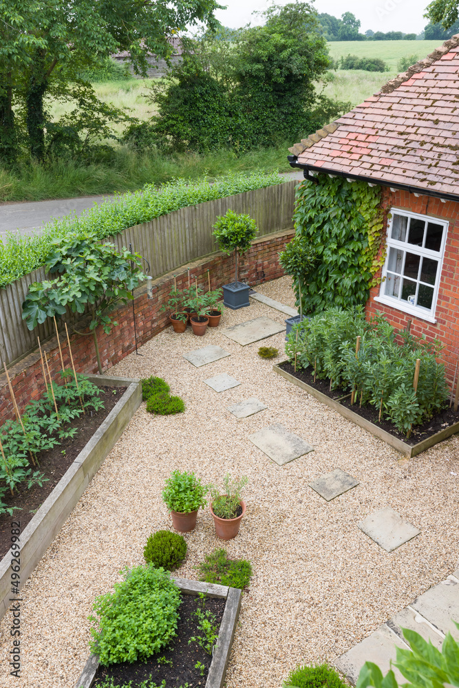 Landscaped garden with gravel, and York stone, UK garden design