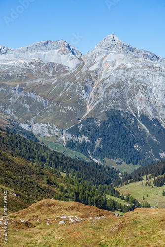 The Swiss alps of the canton of graubünden seen during a summer day, near the Spluga pass, on the border between Italy and Switzerland - September 2021.