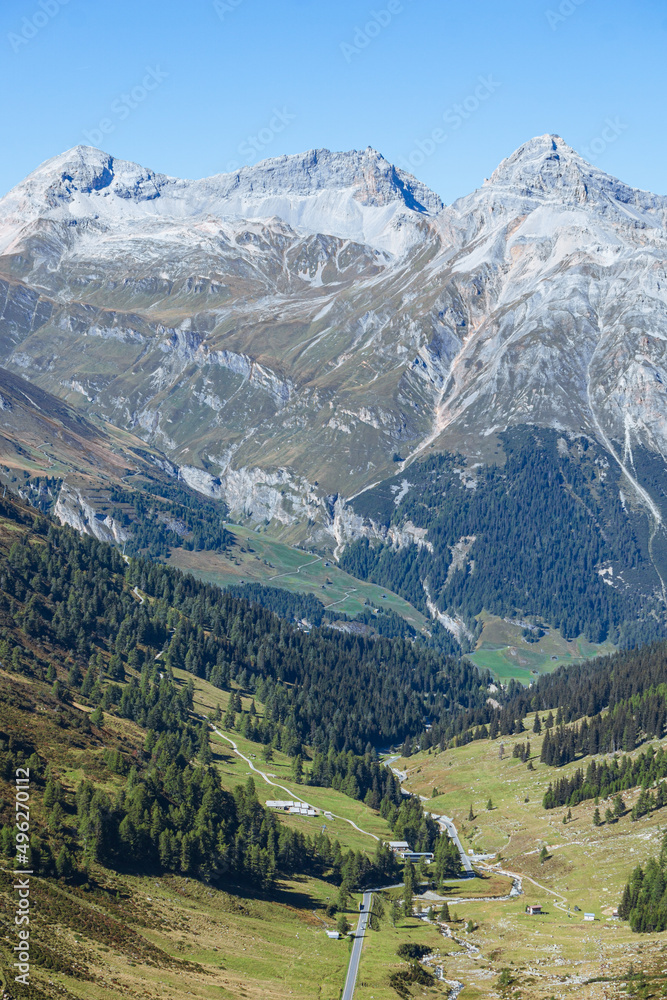 The Swiss alps of the canton of graubünden seen during a summer day, near the Spluga pass, on the border between Italy and Switzerland - September 2021. The Swiss alps of the canton of graubünden seen during a summer day, near the Spluga pass, on the border between Italy and Switzerland - September 2021.