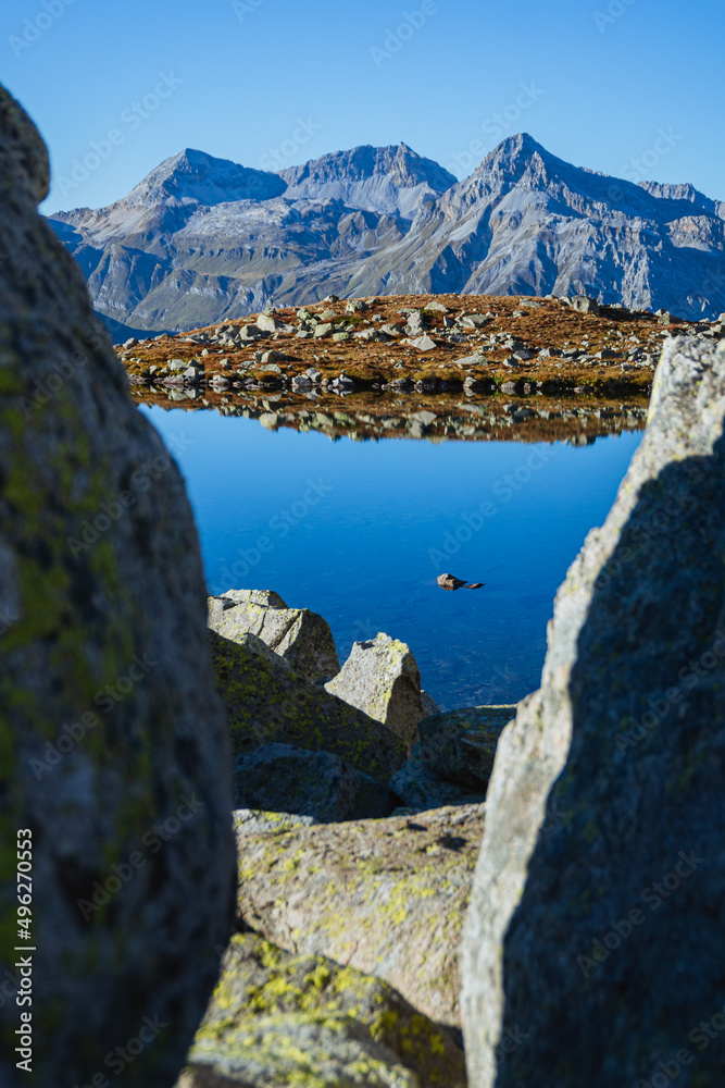 Obraz premium The Swiss Alps seen from the Bergseeli: a small high-altitude alpine lake on the border between Switzerland and Italy, near the Spluga Pass - September 2021