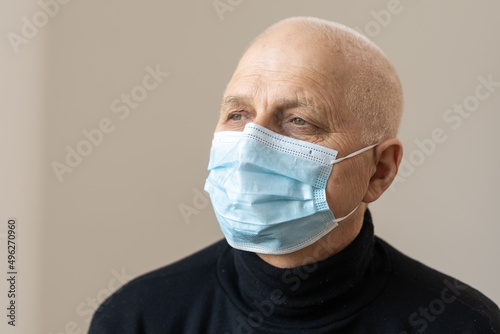 portrait of an elderly man in a mask
