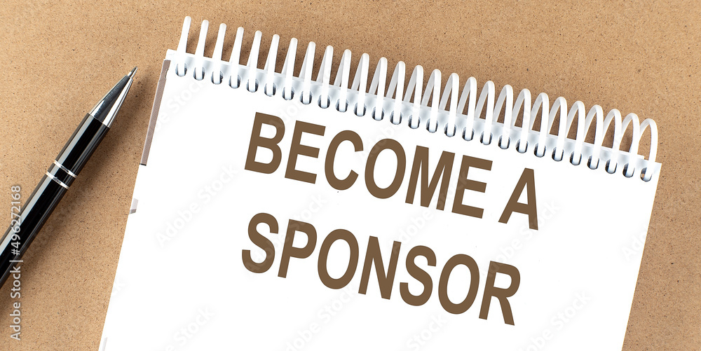 BECOME A SPONSOR text on a notepad with pen, business BECOME A SPONSOR text on a notepad with pen, business
