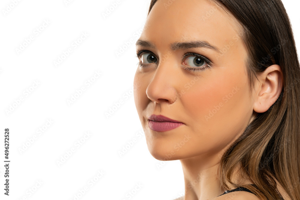 portrait of a young beautiful woman with blue eyes and makeup on a white background portrait of a young beautiful woman with blue eyes and makeup on a white background