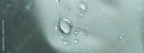 waterproof fabric with waterdrops. non woven fabric water texture background Water drops on waterproof nylon fabric. soft focus