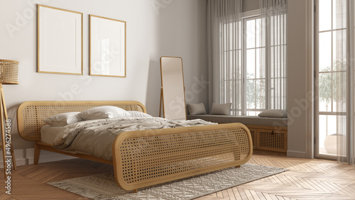 Scandinavian modern wooden bedroom with rattan furniture in white tones, frame mockup, double bed with duvet and pillows, window with bench, carpet, mirror, lamp and decors. Parquet photo