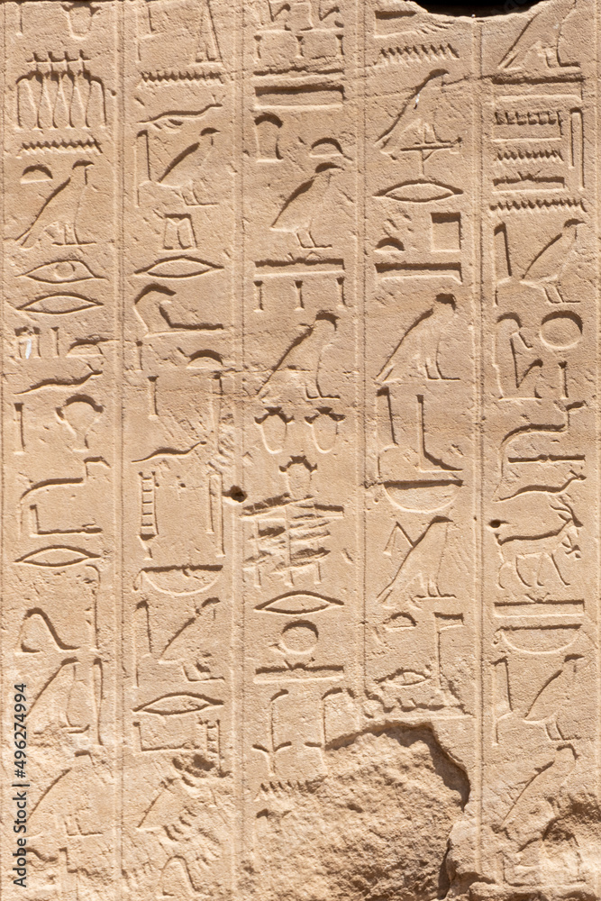 Ancient Egyptian murals and hieroglyphs on the stone walls of the Karnak Temple in Luxor, Egypt Ancient Egyptian murals and hieroglyphs on the stone walls of the Karnak Temple in Luxor, Egypt