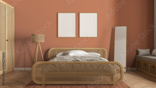 Frame mockup, modern wooden bedroom with rattan furniture in orange tones, double bed with duvet and pillows, carpet, mirror, lamp and decors. Herringbone parquet, interior design