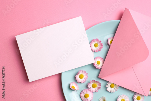 Invitation or greeting card mockup with envelope and daisy flowers
