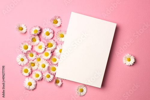 Invitation card mockup with white daisy flowers on pink © nikavera