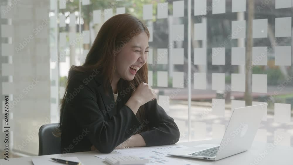 Happy young woman looking at laptop screen, Good news, happy laughing. Meeting online. Joke funny and relax time. Happy young woman looking at laptop screen, Good news, happy laughing. Meeting online. Joke funny and relax time.