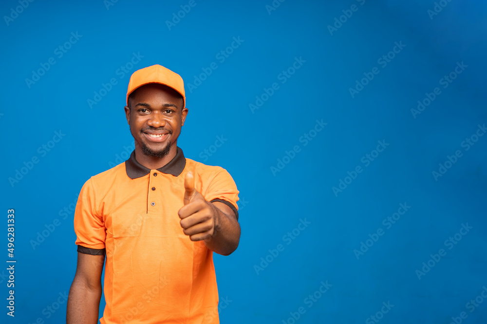 delivery employee in orange cap smiling as he did thumbs up