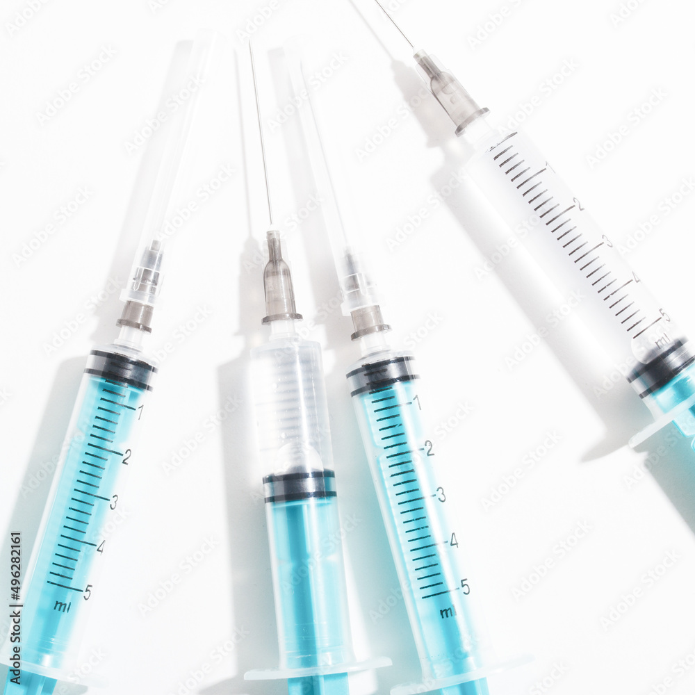 medical disposable plastic syringe for injection in the hospital isolated on a white background medical disposable plastic syringe for injection in the hospital isolated on a white background