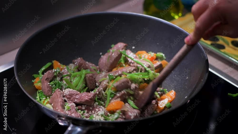 Preparing Recipe Sesame beef wok, minced summer vegetables, France