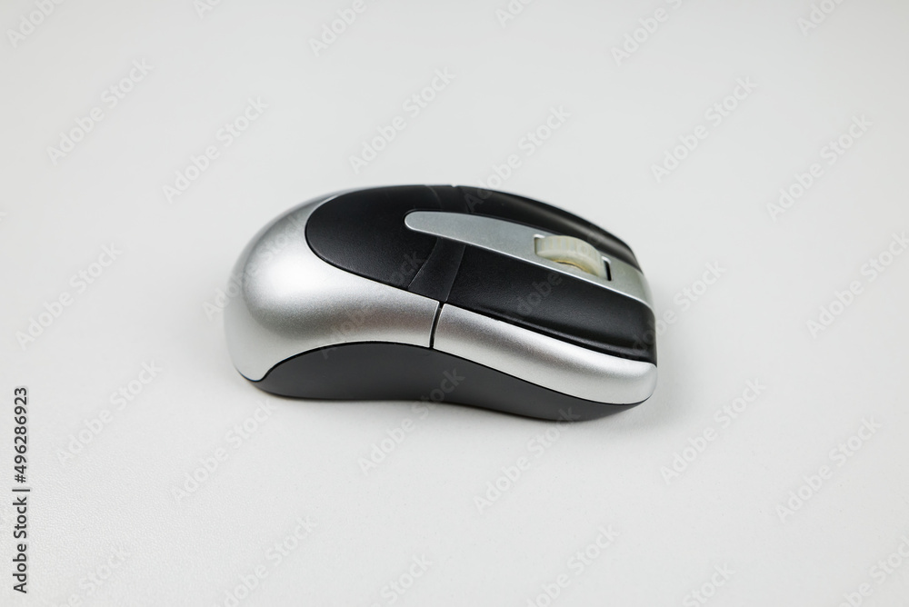 gray wireless mouse on a white background. gray wireless mouse on a white background.