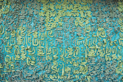 Camouflage military mesh, hunter net background.
