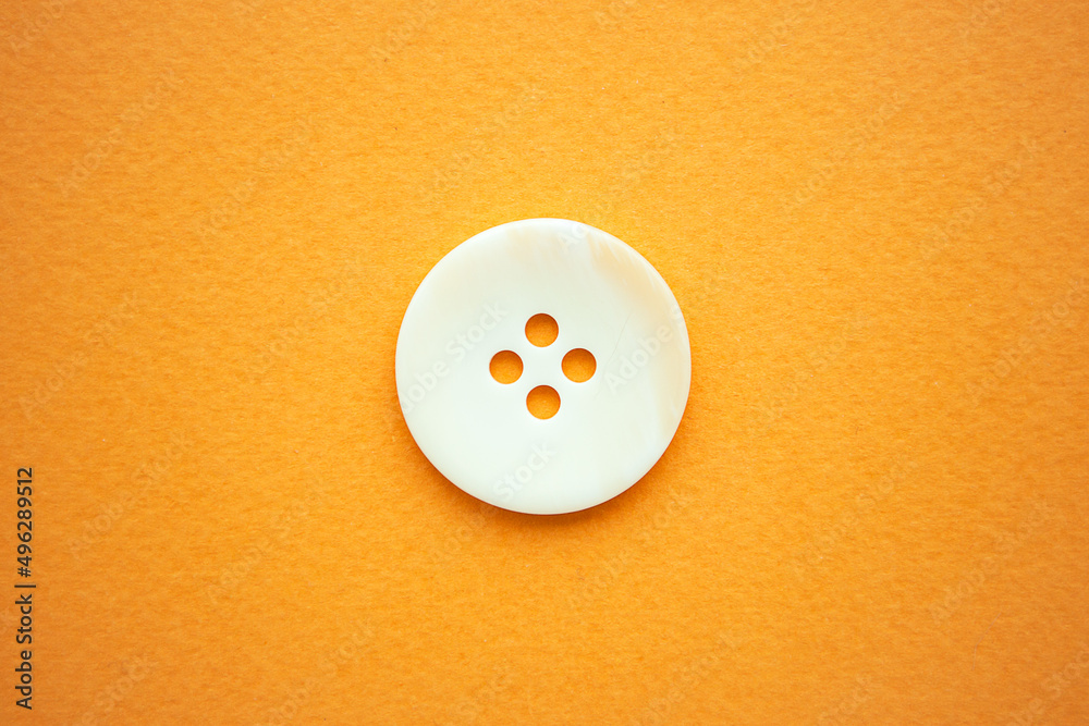 One big white button on yellow background, copy space One big white button on yellow background, copy space