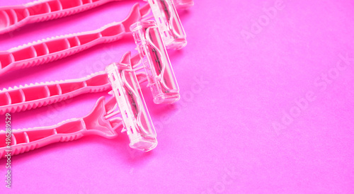 New pink disposable razors for safe shaving of female skin.Razor for smooth shaving. Sharp razors for personal hygienic routine. selective focus. 