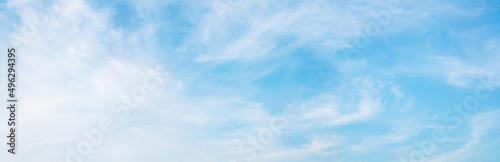 Abstract white puffy clouds and blue sky background.