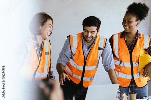 Wallpaper Mural In the Industrial Engineering Facility: Diverse Group of Engineers, Technicians, and Specialists on a Meeting, Have Discussion, Analyse Engine Design Technical Drafts that are Lying on the Table Torontodigital.ca