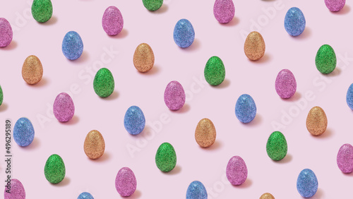 Trendy easter pattern with colorful glitter eggs on pastel pink background