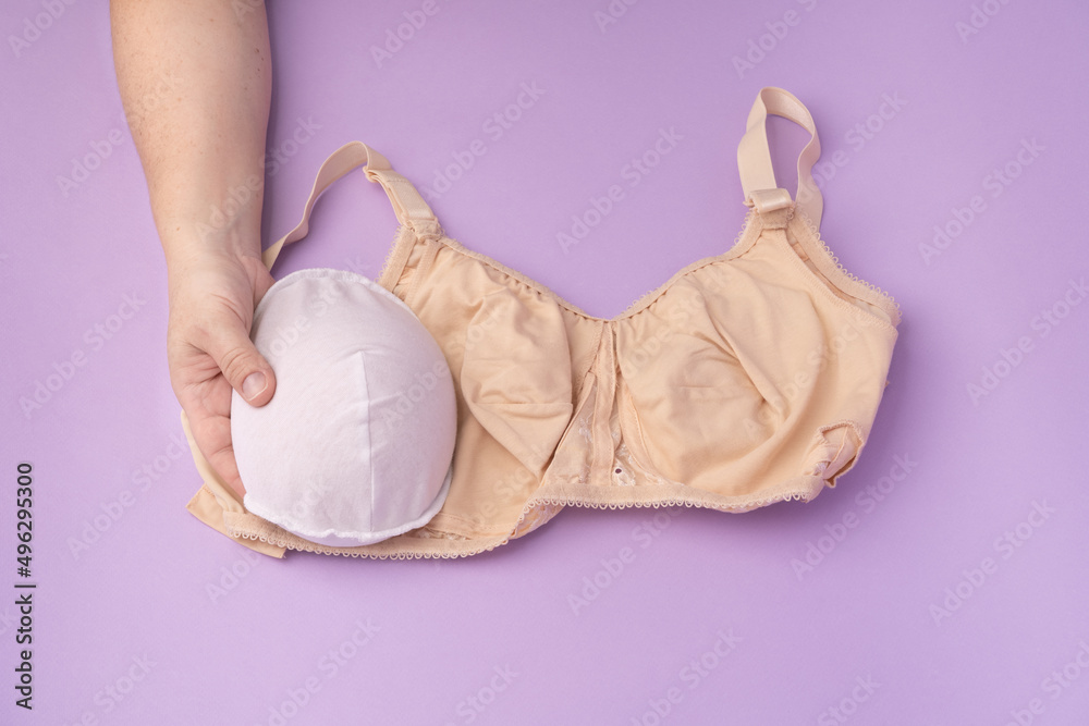 Breast prosthesis before inserting it into the special bra. Breast  prosthesis and post surgery bra for breast cancer patient after mastectomy  Stock Photo