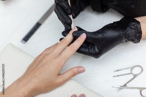 Manicurist workflow with client's nails. Nail care, manicure